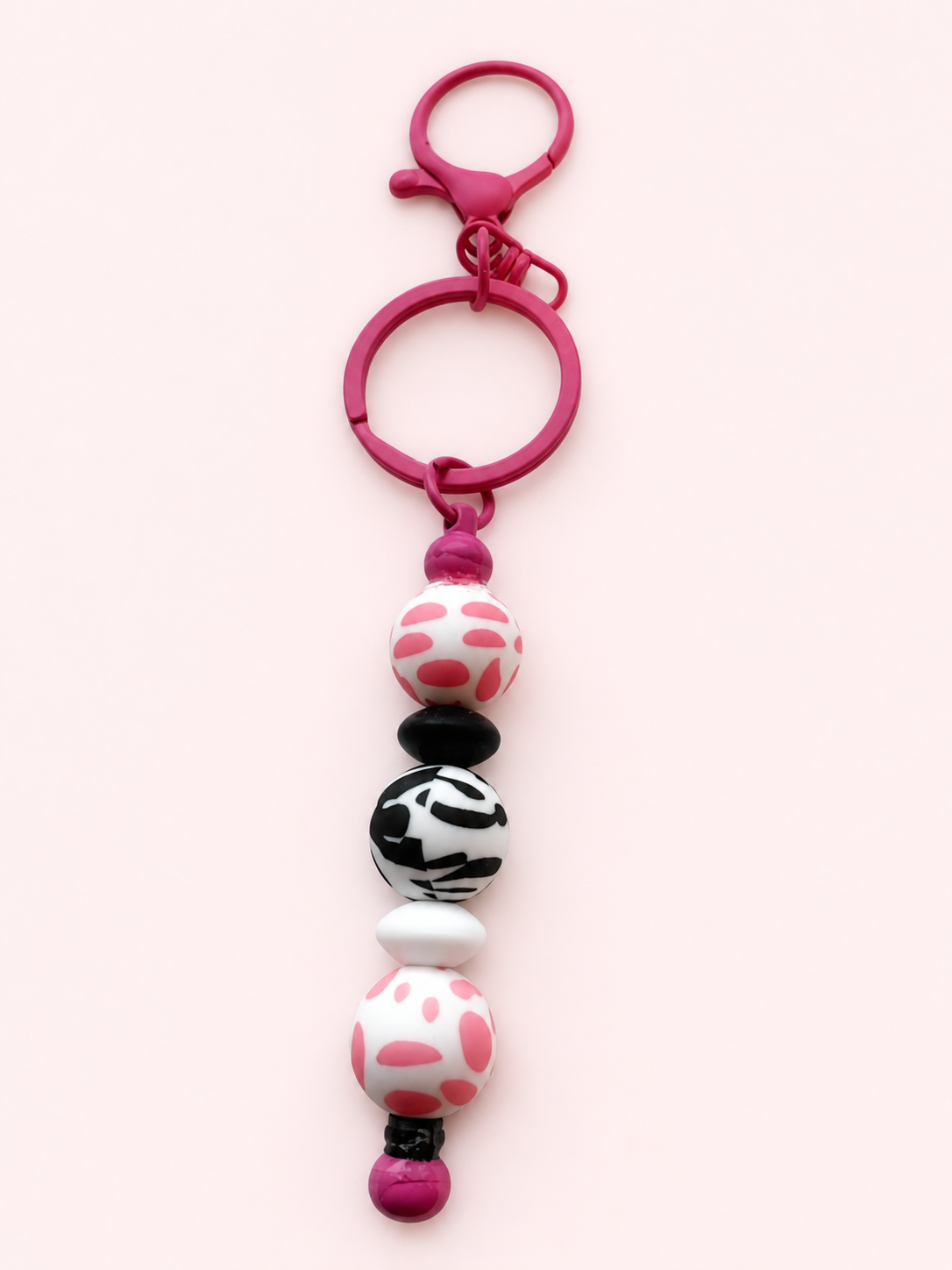Pink and black patterned bead keychain